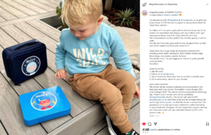 boy looking down at his personalised hippo blue lunch box and bag